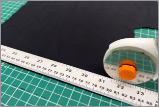 Marking the nylon strap with a ruler and rotary cutter