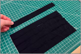 Measuring a nylon strip against a ruler