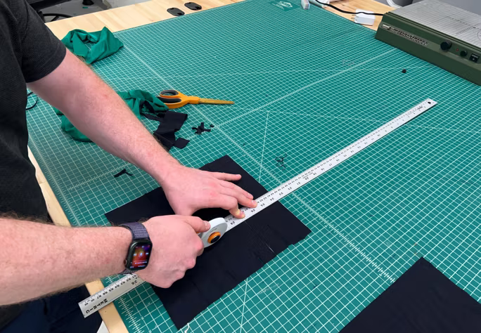 Cutting the nylon strap on a green cutting mat
