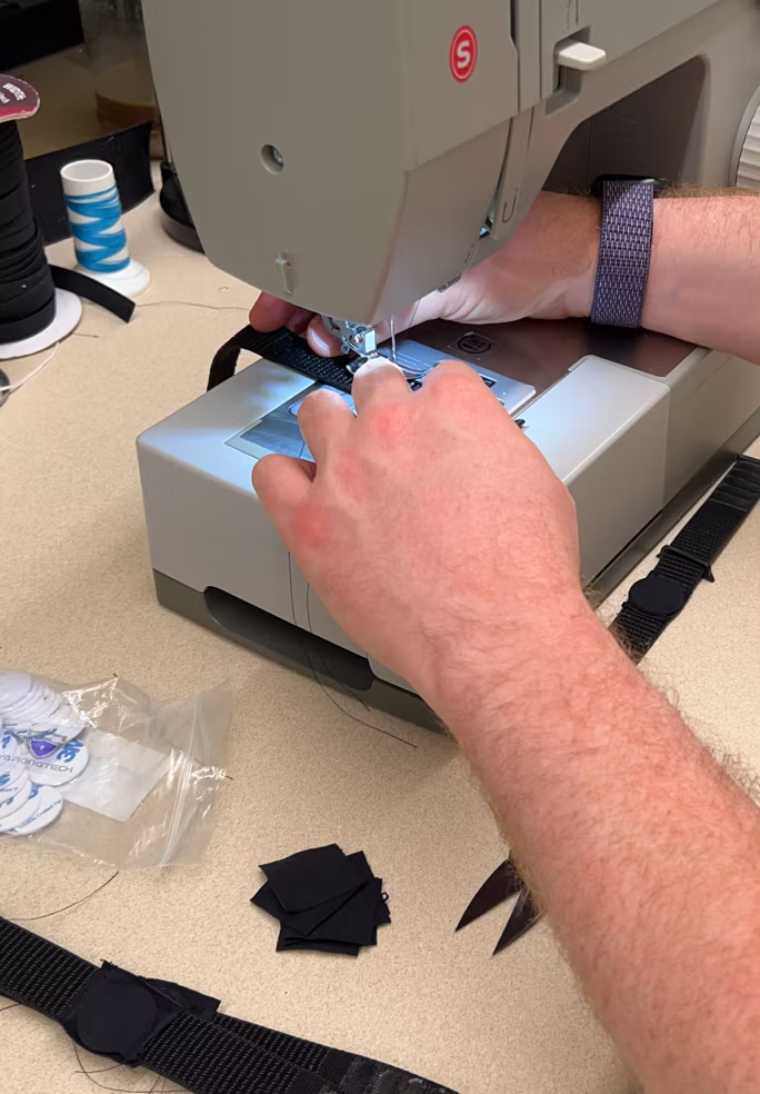 Sewing an RFID-chip pouch into the band on a sewing machine